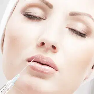 Face and Neck Aesthetics Illustration Close-up of a person’s face with a syringe positioned near the upper lip