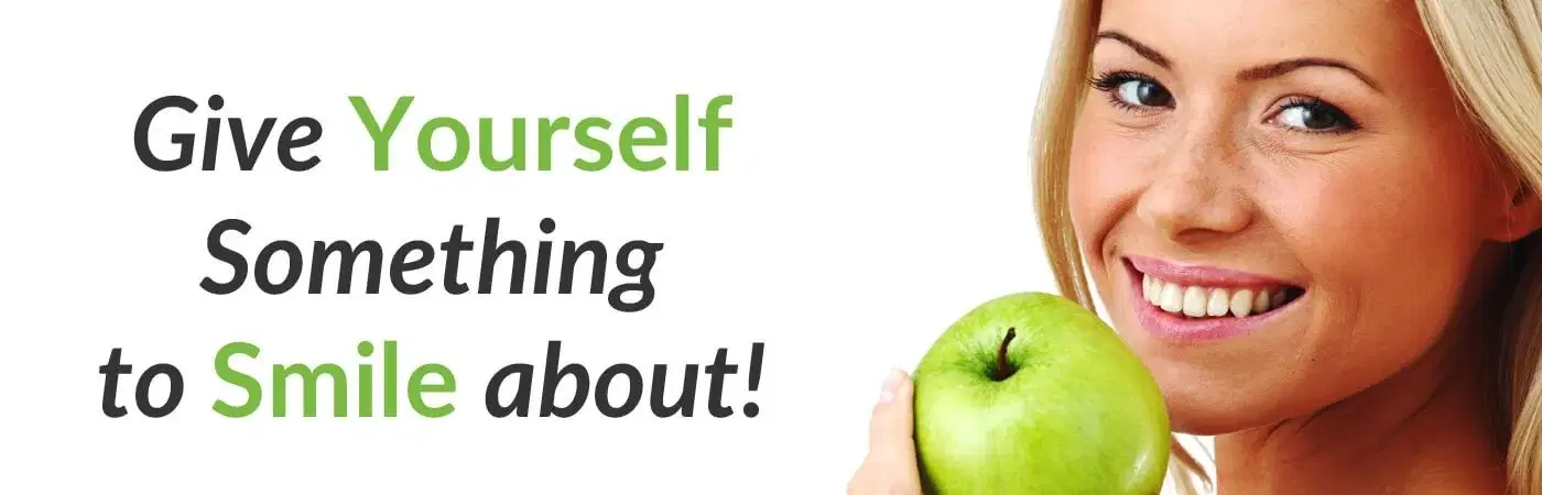 Smiling woman holding a green apple in a dental health promotional image for Wightwick Dental Practice
