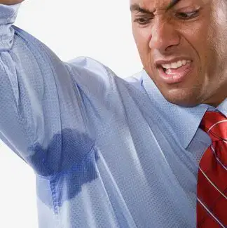 Underarm Sweating Person lifting an arm to reveal a sweat patch on a blue shirt
